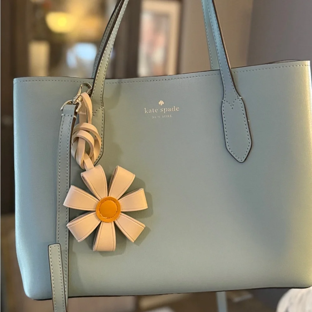 Gorgeous like new med Kate Spade Harper leather tote bag with flower bag charm. - Picture 4 of 10